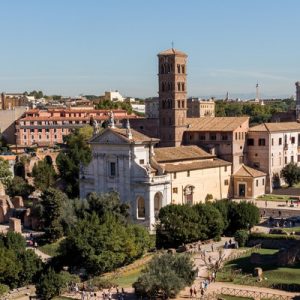 aerial view of the roman forum with the colosseum in the distance