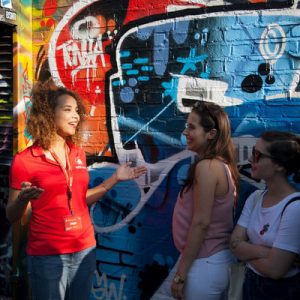 guide explaining to group london street art