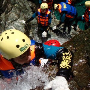 people climbing up against the stream during the river tracing in hualien