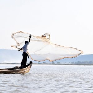 fisherman casting a net