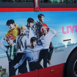 Seoul City Tour Bus with a K-pop Banner