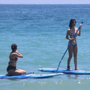 woman stand up paddle boarding